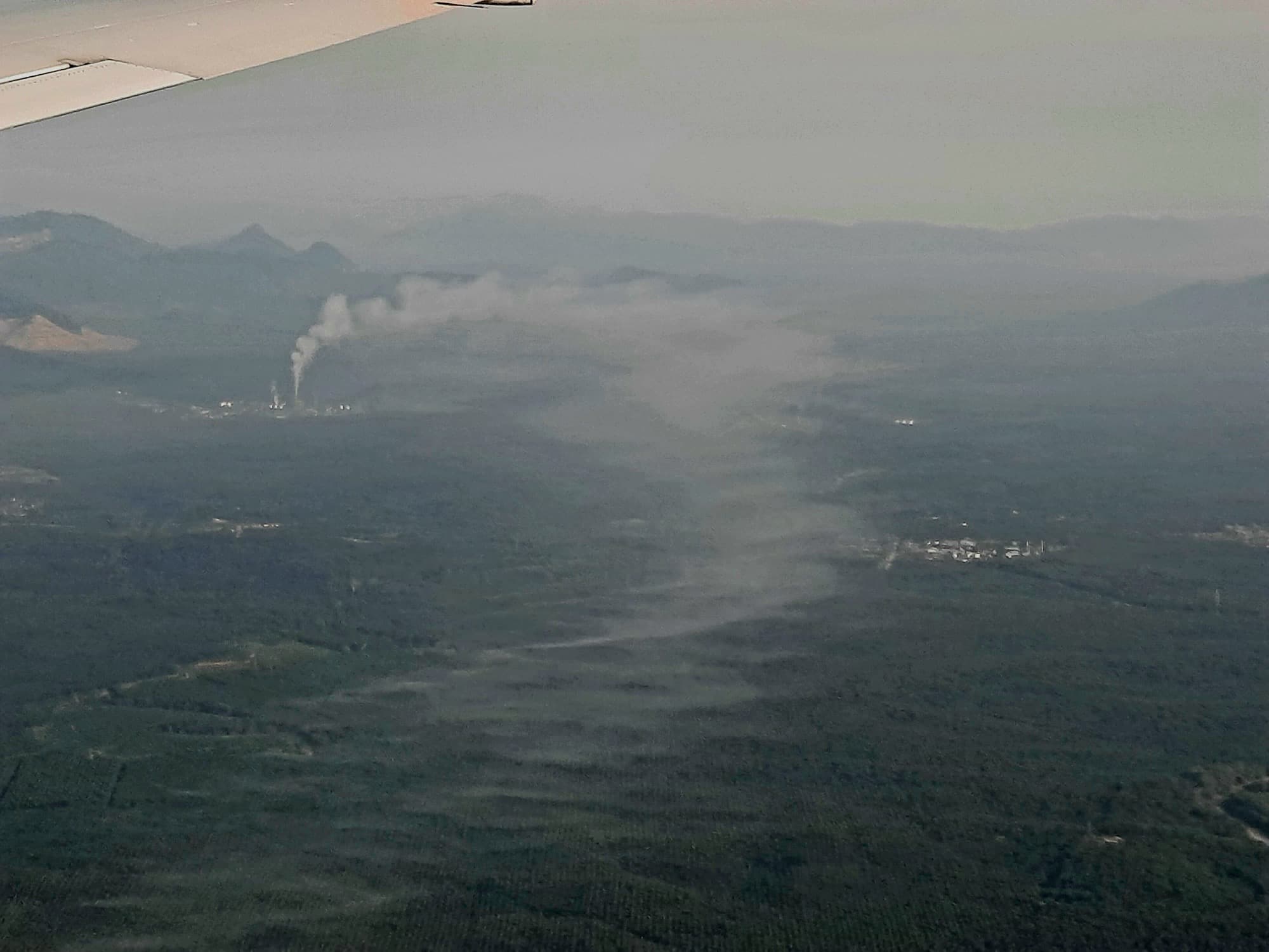 Smoke rising from a palm oil mill in Tawau, Sabah, Malaysia.
